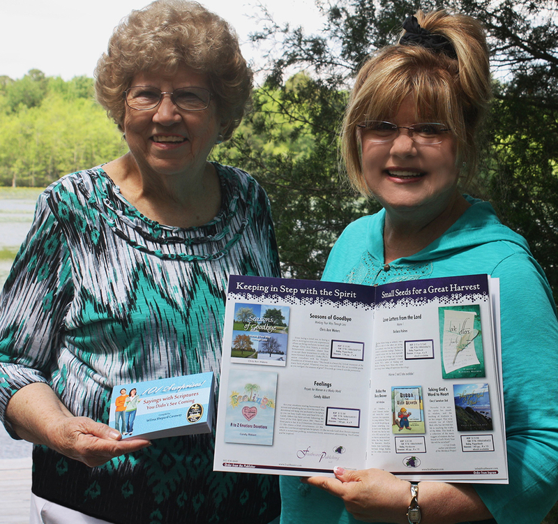 Wilma Caraway, left, displays her book, "101 Surprises! Sayings with Scriptures You Didn’t See Coming," winner of the 2014 Christian Small Publisher Book of the Year contest in the Gift Book category. Candy Abbott, her publisher, holds the CSPA product catalog featuring additional Fruitbearer Publishing titles. SOURCE SUBMITTED
